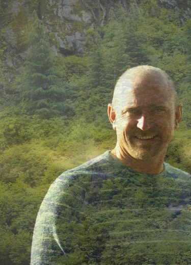 Digital composite of man and forest.