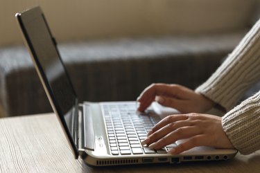 Woman hands working on keyboard