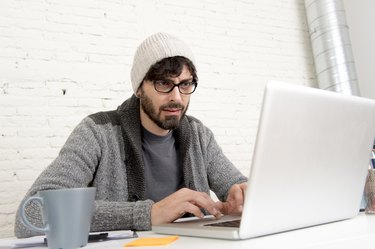 corporate portrait  young hispanic hipster businessman working at office