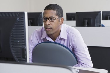 Serious African American Businessman Working on Computer