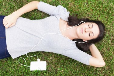 Relaxed woman listening music