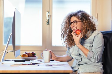 Young woman working at home or in a small office