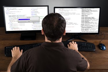 Man Programming Code On Computers