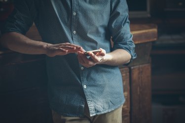 Young hipster using a mobile phone