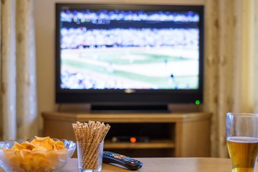Television, TV watching (baseball match) with snacks and alcohol