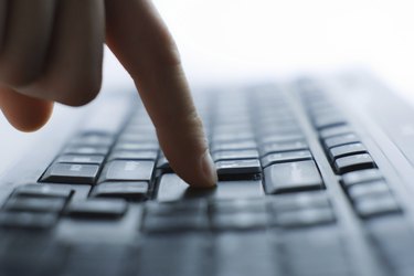 Close-up of typing male hands on keyboard