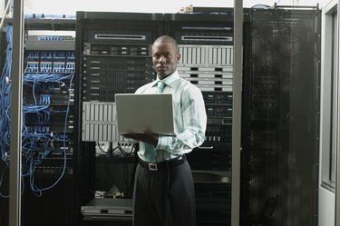 Businessman holding laptop computer