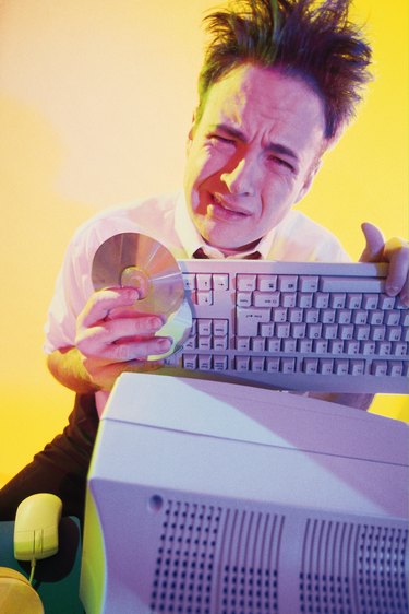 Frustrated businessman with computer