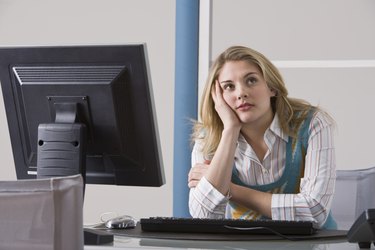 Bored businesswoman at computer
