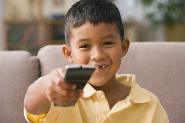 Young boy using a remote control