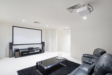 Home Theater Room with black leather recliner chairs