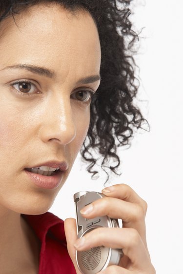 Woman with voice recorder