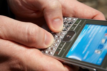 Close-up of person texting on smartphone