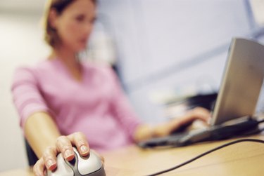 Woman sitting at a computer