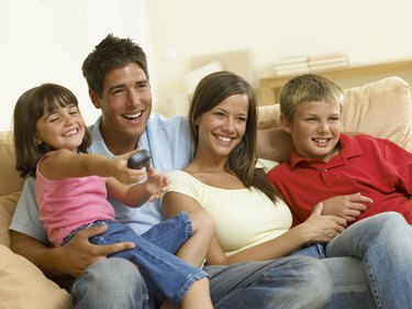 Family watching television together