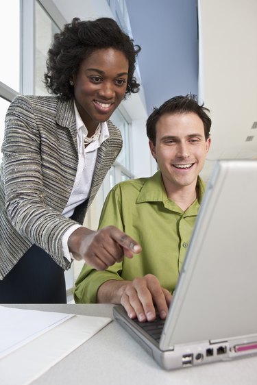 Business executives using a laptop