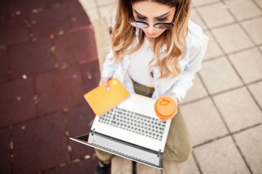 Young woman with a book and coffee