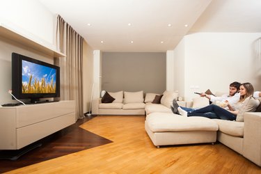 Couple eating popcorn while watching a movie