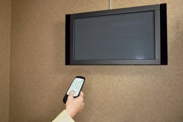 Woman using flat panel television