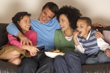Family watching television together