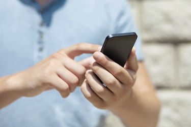 boy holding phone and a touch screen for finger