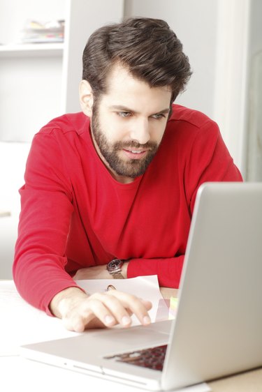 Young businessman working in architect studio