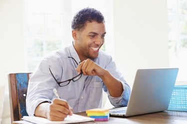 Businessman Working In Office At Home