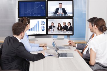 Businesspeople Looking At Computer Screen