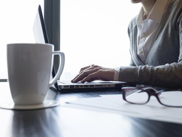 Businesswoman using laptop