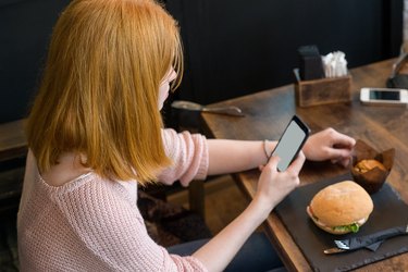 Girl sitting and looking at the phone