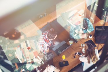 Group of people sitting at a cafe, talking and enjoying