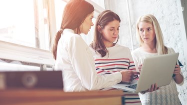 Women discussing project plan