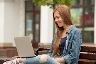 Young stylish woman with a laptop.