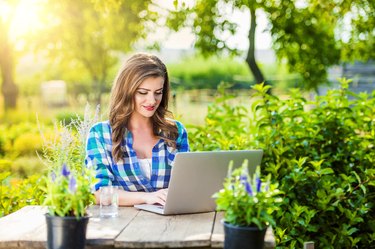 Beautiful young woman gardening