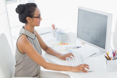 Designer working at her desk using computer