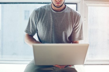 Young man working with laptop