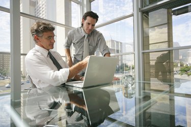 Businessmen using a laptop