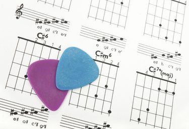 Guitar picks on a chords chart