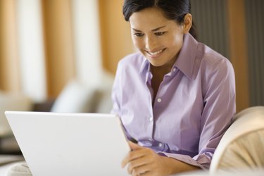 Woman working on laptop computer