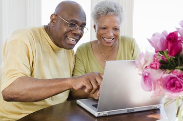 Couple using laptop computer