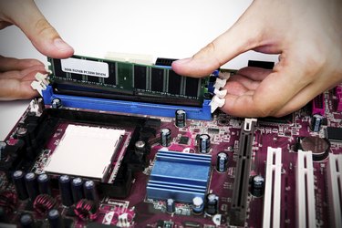 Man installing memory. PC motherboard RAM upgrade
