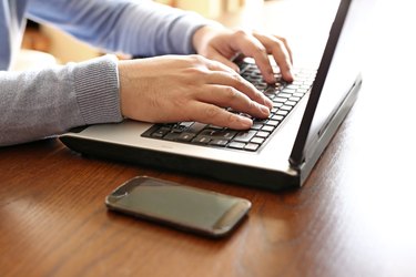 Man working on laptop at home