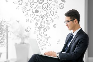 Young asian businessman using tablet, social media