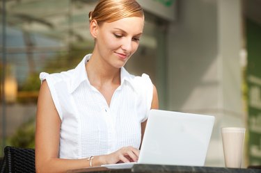 Businesswoman With Coffee & Laptop