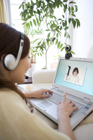 Young woman having a video conference on her laptop