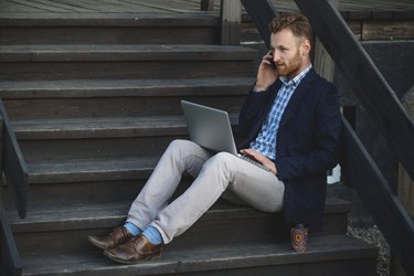 Handsome businessman working with laptop