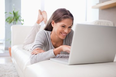 Woman on the sofa chatting online