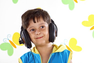 Boy listening to music wearing head phones
