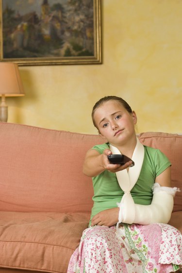 Bored girl in arm cast