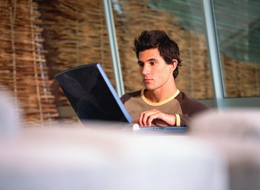 Young man working with a laptop